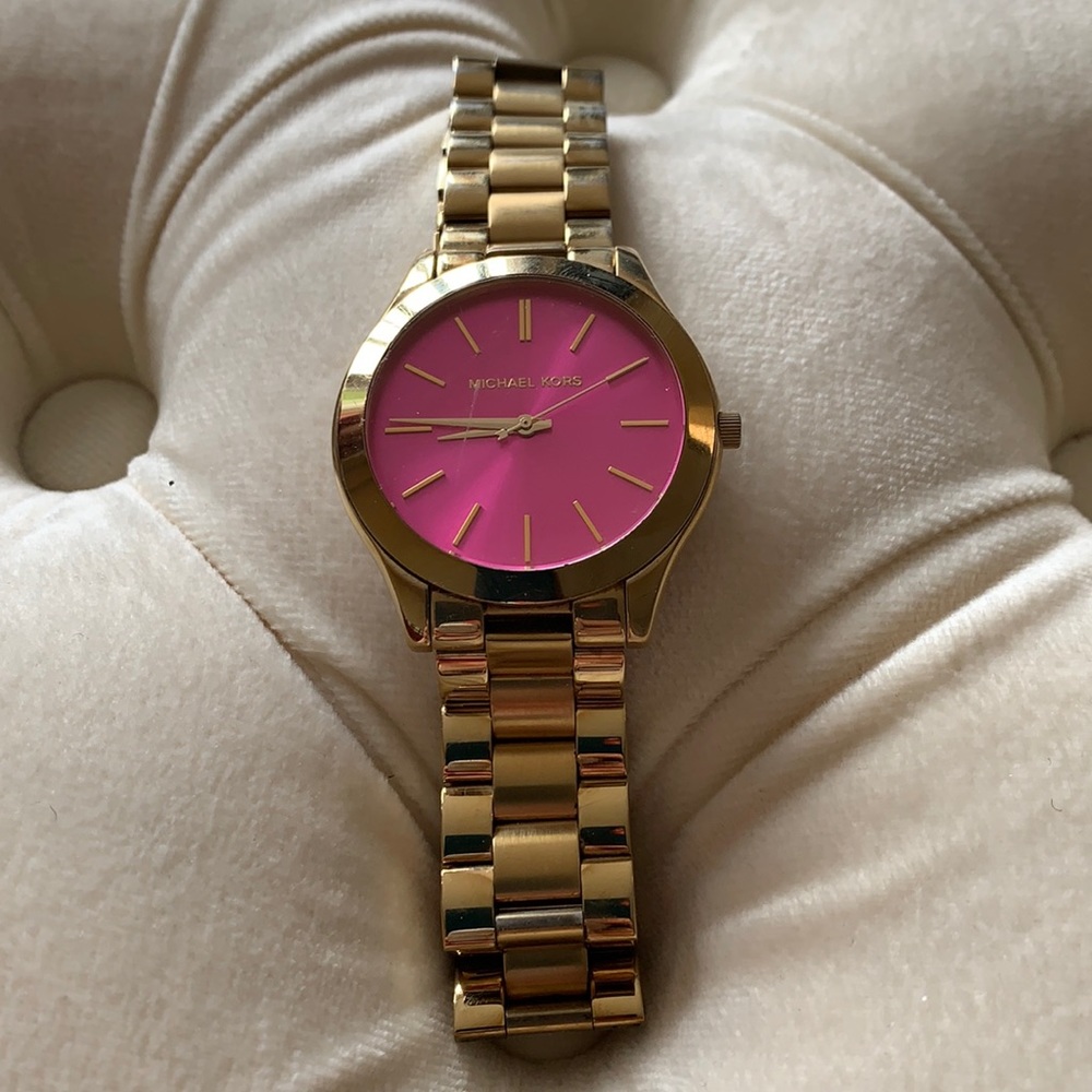 Michael Kors pink face bracelet watch.